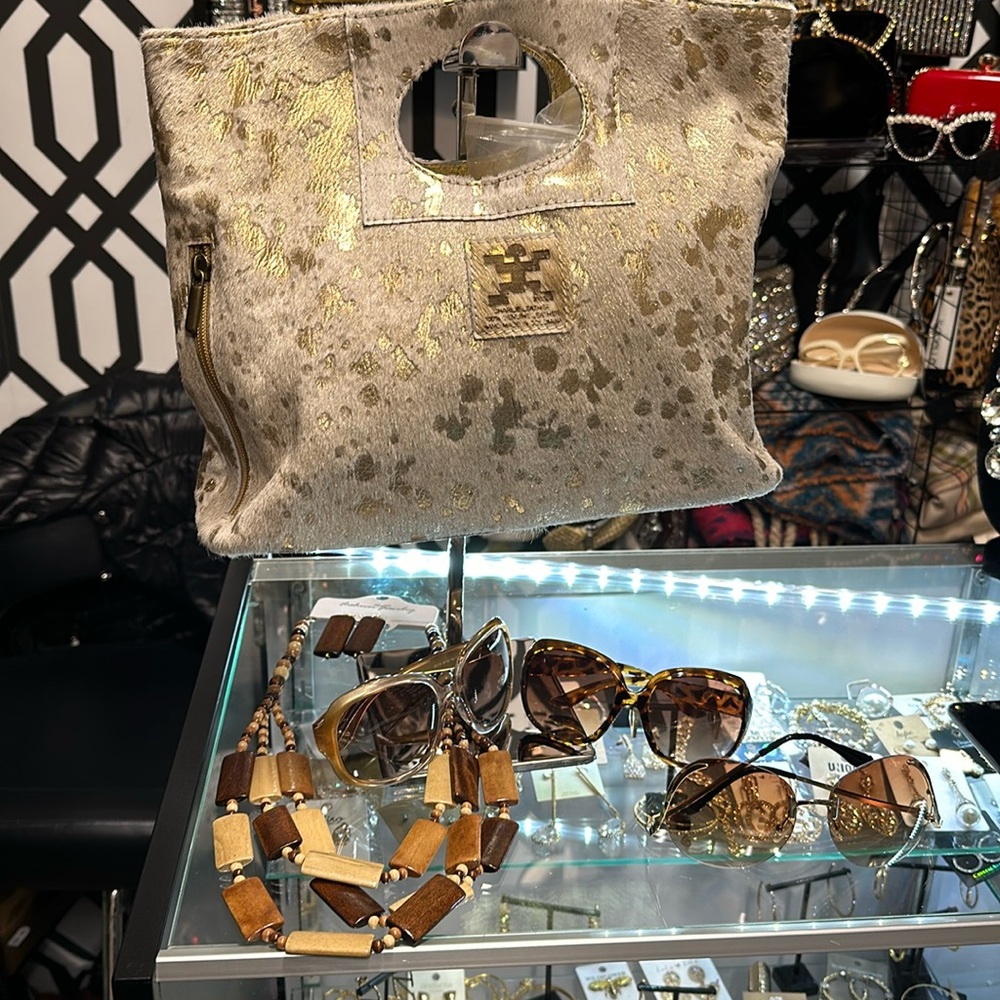 A crossbody Charlie Leather handbag can be carried as a clutch